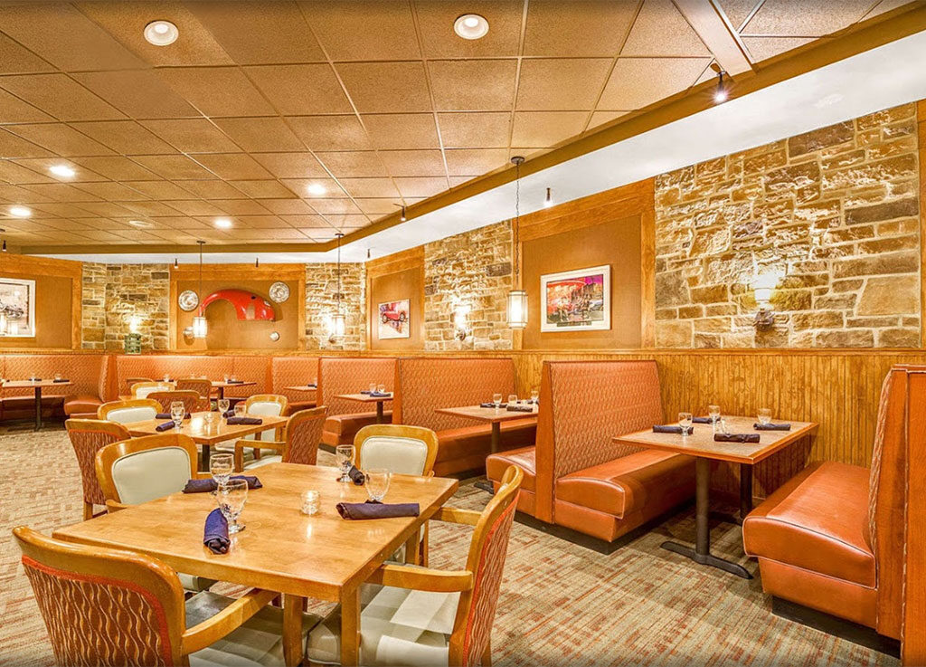 Booth seating and stone walls in the FenderZ dining room